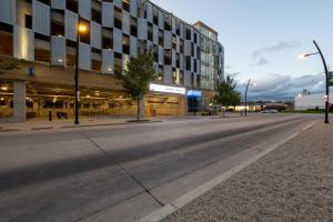 an empty street in front of a building at Flexhome Skywalk to Fiserv 1BR Apt U7 - READ INFO in Milwaukee