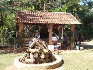 a small building with a roof on top of it at Estalagem das Estrelas in Cristalina