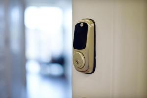 a close up of a door with a gold handle at HostWise Stays - Free Garage Parking, Gym, City Views! in Pittsburgh