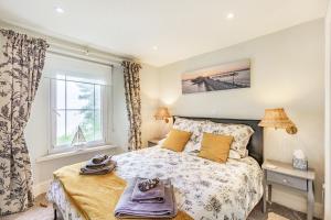 a bedroom with a bed and a window at Pier View in Weston-super-Mare