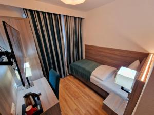 Postel nebo postele na pokoji v ubytování Sophien Hotel