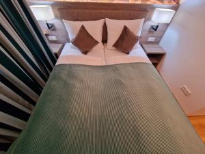 Postel nebo postele na pokoji v ubytování Sophien Hotel