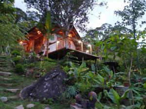 a house in the middle of a garden at Alojamiento Natural La Cueva de Morgan San Rafael in San Rafael