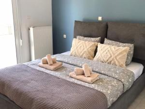 a large bed with two pillows on top of it at Garden Villa Near Chania s Coastline in Xirostérnion +32 photos