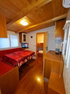 a bedroom with a red bed in a room at LA CASA DEL SOLE in Merone +33 photos