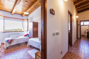 A bed or beds in a room at Villa Olive tree, immersa nella natura per relax e quiete