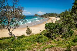 a view of a beach with people in the ocean at Laurel 14 in Port Macquarie