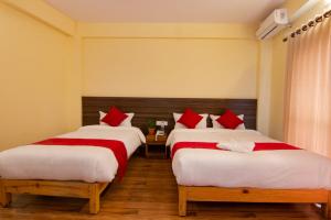 Postel nebo postele na pokoji v ubytování Hotel bivhuti
