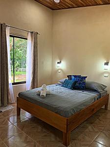 a bedroom with a bed in a room with a window at Apartamento Entero El Guanacaste. in Santa Cruz