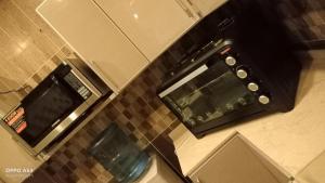 an overhead view of a kitchen with a toaster oven at anoor appartment,just relaxe in Obhor
