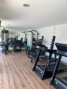 a gym with treadmills and cardio equipment in it at Imbassaí Solaris Ap Beach in Imbassai
