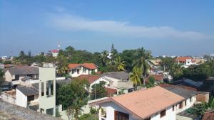 a view of a city with houses and trees at Hitchhike Backpackers in Mount Lavinia