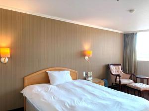 Postel nebo postele na pokoji v ubytování Hermes Hotel
