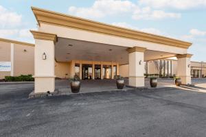 an empty parking lot in front of a building at Wyndham Omaha Hotel - West Dodge in Omaha