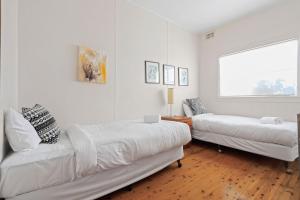 Postel nebo postele na pokoji v ubytování Elizabeth Cottage, Jervis Bay