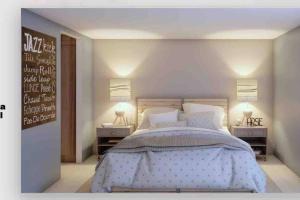 a bedroom with a large bed with two night stands at Hermosa casa en Acapulco con club de Playa. in Acapulco