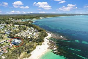 an aerial view of a resort on the beach at The Beach Studio in Huskisson
