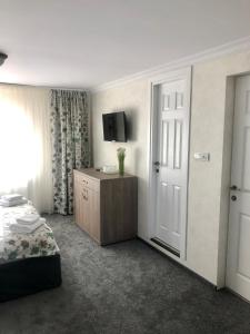 Postel nebo postele na pokoji v ubytování BUCEGI VIEW APARTAMENT
