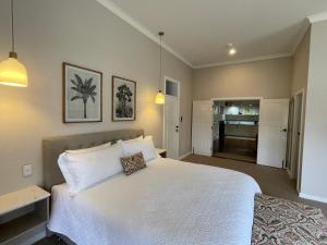 Säng eller sängar i ett rum på Winniston Lodge Luxury Accommodation