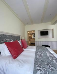 Postel nebo postele na pokoji v ubytování Hotel Regina