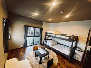 Postel nebo postele na pokoji v ubytování Hostel SAMURISE KURA