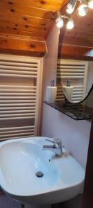 a bathroom with a white sink and a mirror at Locanda San Martino in Massac +34 photos