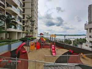 a playground in a apartment complex with a play park at Bay Laurel, Country Garden Danga Bay Homestay By WELCOME HOME in Johor Bahru