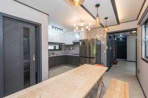 A kitchen or kitchenette at The Some Plus Onpyeong