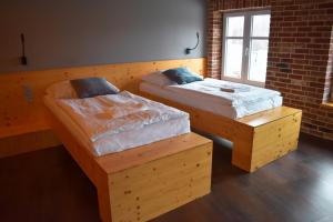 Voodi või voodid majutusasutuse Pivovar Kocour toas