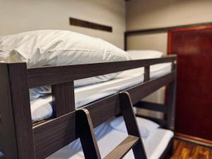 Postel nebo postele na pokoji v ubytování Hostel SAMURISE KURA