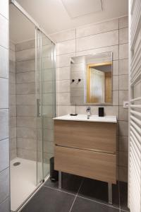 a bathroom with a sink and a shower at TERRESENS - L'ALTARENA in Les Saisies