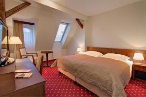 Postel nebo postele na pokoji v ubytování Clarion Grandhotel Zlaty Lev