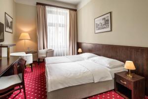 Postel nebo postele na pokoji v ubytování Clarion Grandhotel Zlaty Lev