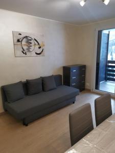 a living room with a couch and a dresser at Belvedere Tonale in Passo del Tonale