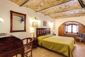 Postel nebo postele na pokoji v ubytování Hotel Gea Di Vulcano