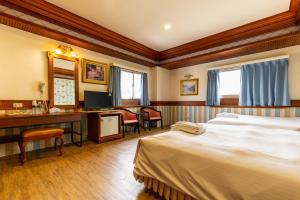 TV a/nebo společenská místnost v ubytování I HI Sanduo Travel Hotel