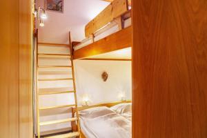 a bedroom with two bunk beds and a staircase at Haus Excelsior Top 13 in Seefeld in Tirol