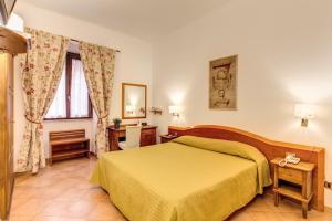 Postel nebo postele na pokoji v ubytování Hotel Gea Di Vulcano