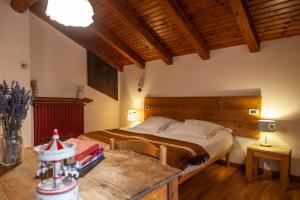 Postel nebo postele na pokoji v ubytování Maison Le Champ B&B Questa casa non è un albergo