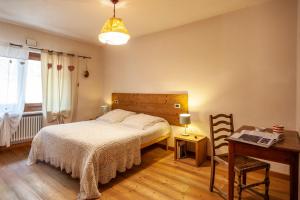 Postel nebo postele na pokoji v ubytování Maison Le Champ B&B Questa casa non è un albergo