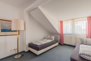 Postel nebo postele na pokoji v ubytování Pension für Monteure in Dresden, Zimmer mit eigenem Bad und großer Gemeinschaftsküche