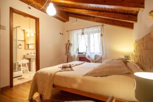 Postel nebo postele na pokoji v ubytování Maison Le Champ B&B Questa casa non è un albergo