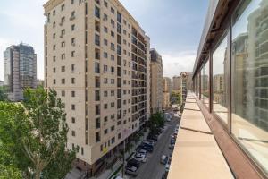 a view of a tall building from a window at Solutel Apartments-35 in Bishkek