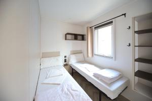 Postel nebo postele na pokoji v ubytování Camping Rialto