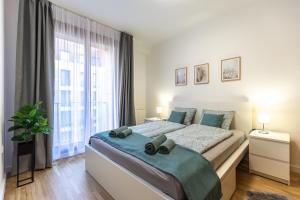 Posteľ alebo postele v izbe v ubytovaní Pleasure Place Apartment