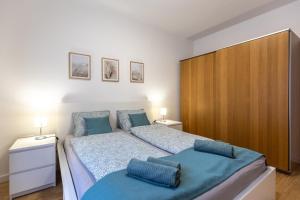 Posteľ alebo postele v izbe v ubytovaní Pleasure Place Apartment