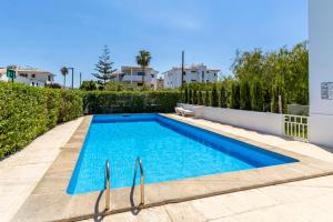 a swimming pool in the backyard of a house at VISTA MONTE II - Francisca in El Port +14 photos
