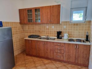Kuchyňa alebo kuchynka v ubytovaní Apartments CHIARA