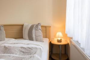 Postel nebo postele na pokoji v ubytování Kiefernglück App 1
