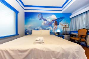 Postel nebo postele na pokoji v ubytování I HI Sanduo Travel Hotel